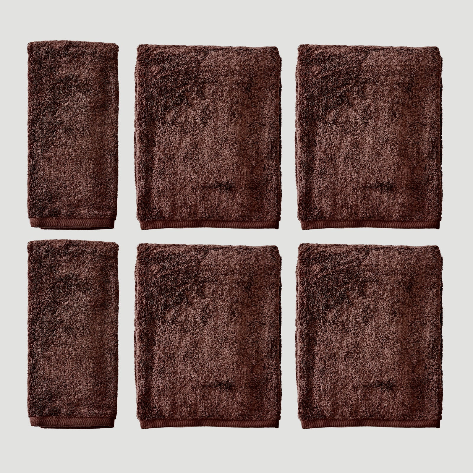 Two dark brown plush hand towels and four bath sheets arranged in a 2x3 grid on a light gray background.