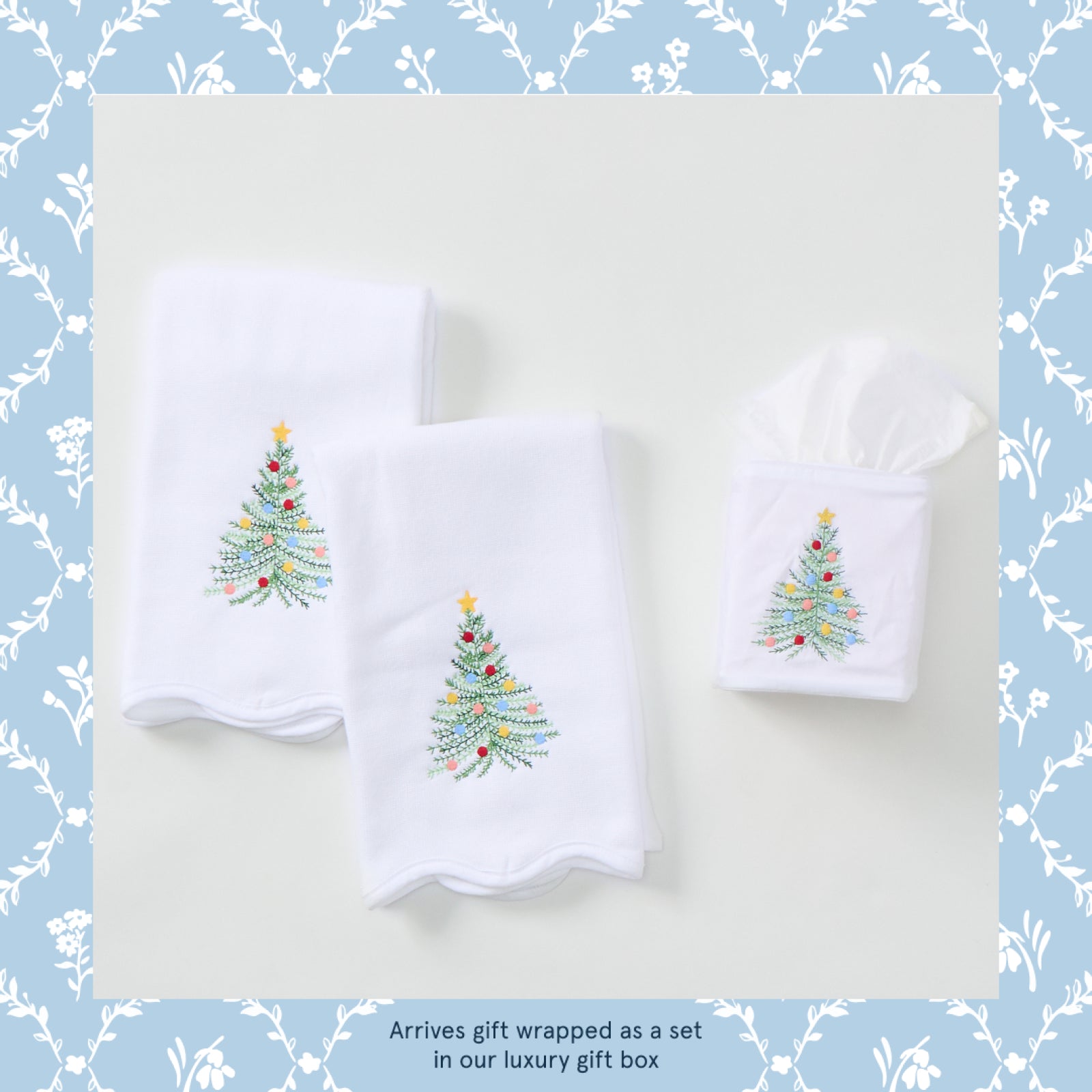 Powder bath towel and tissue box cover gift set in Holiday Tree, two towels and a tissue box cover laid flat