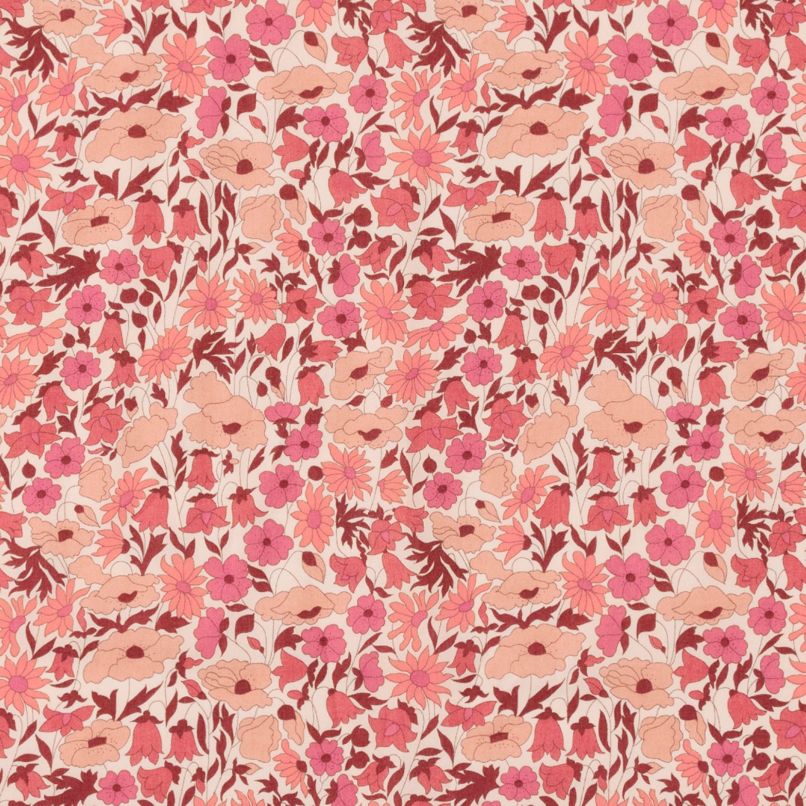 Swatch of the coral and red Liberty floral fabric used for the Liberty Pink Heart appliqué, laid flat.