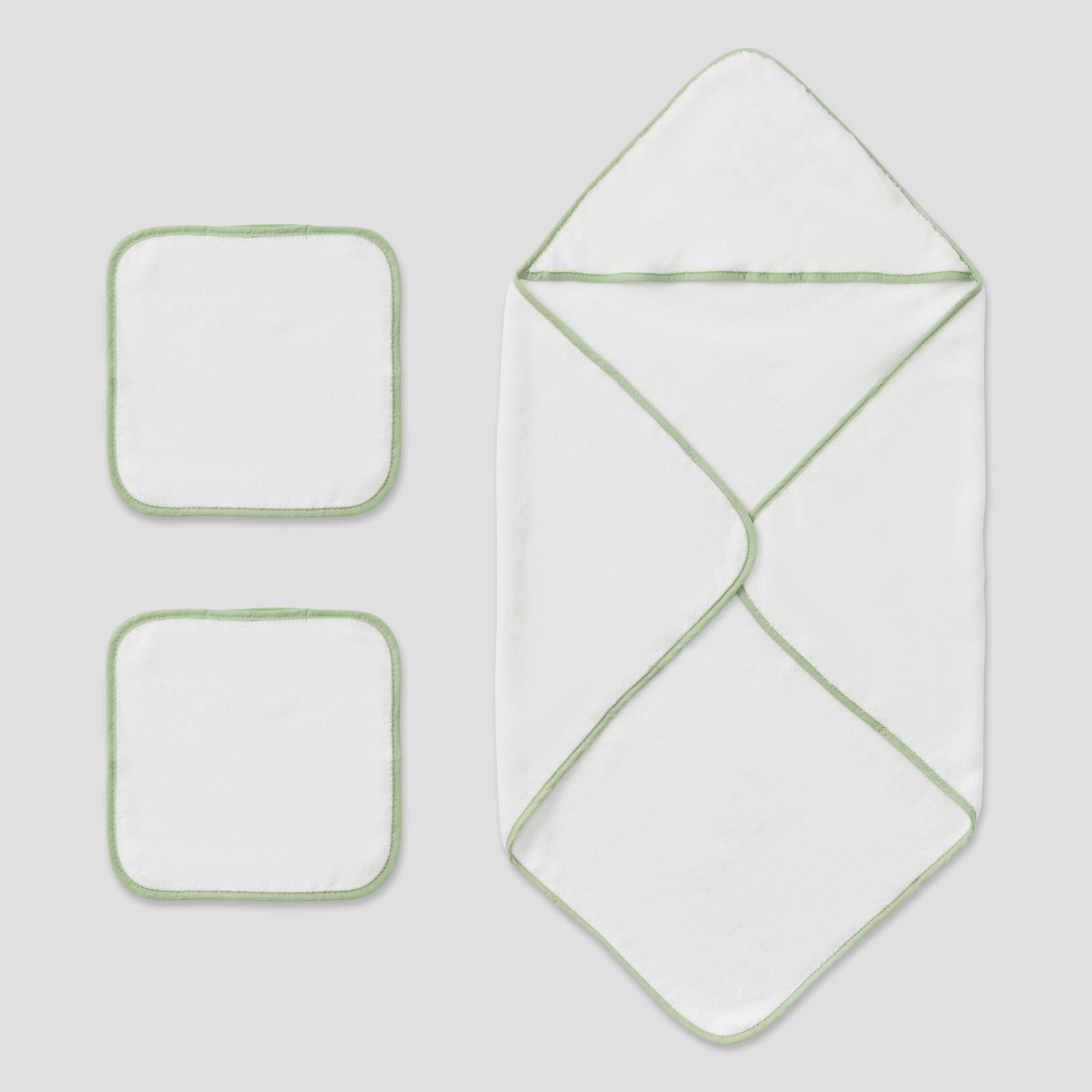 A baby blanket set featuring a large hooded wrap blanket and two smaller square swaddle blankets, all in white with light green piping, arranged on a light gray background.