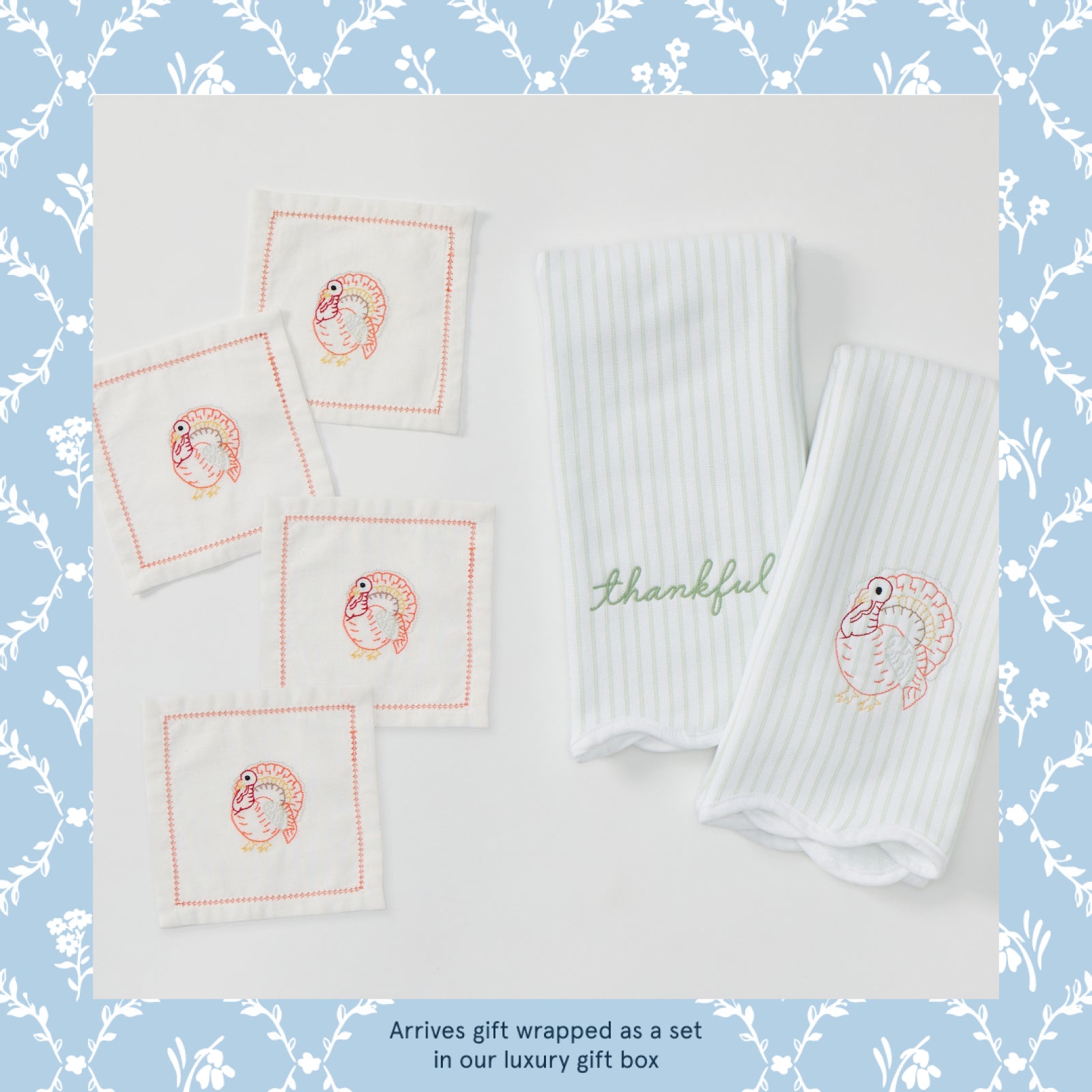 Two green striped kitchen towel and four square cocktail napkins, with embroidered turkey designs, a text at the bottom says "Arrives gift wrapped as a set in our luxury gift box".