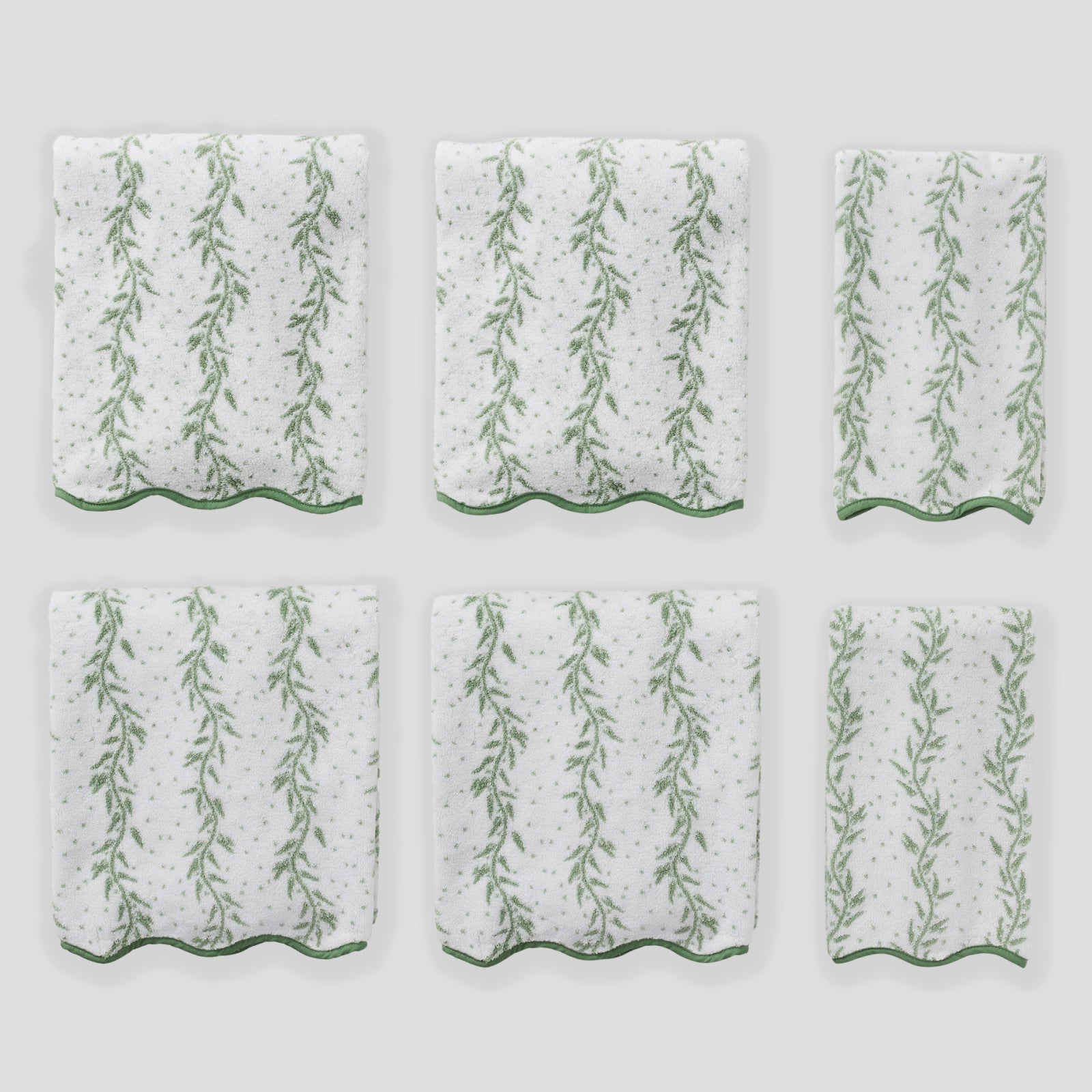 Patterned Scallop Starter Pack in Willow, six folded white towels with a green willow vine print.