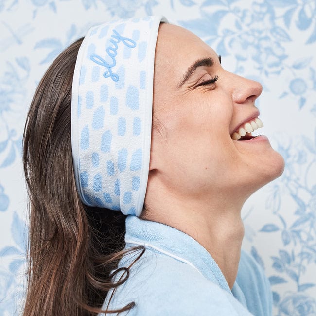 Ready, Set, Glow Duo in Millie — model wearing the blue floral spa headband.